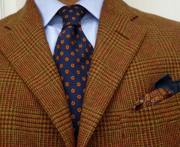 The tie and pocket square should harmonize, not match
