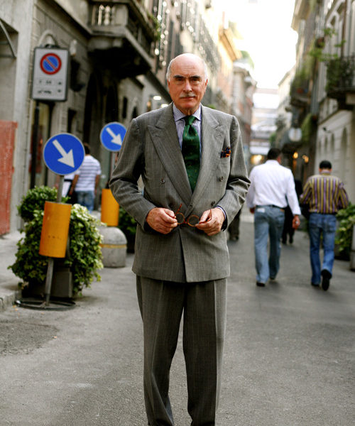 Luciano Barbera is pictured here with a green tie and grey suit
