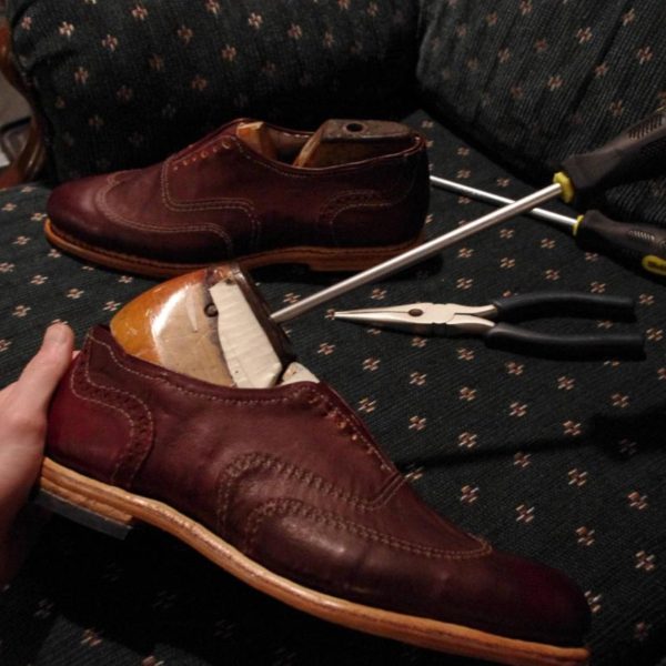 an enormous photo album documenting the process of making shoes by hand