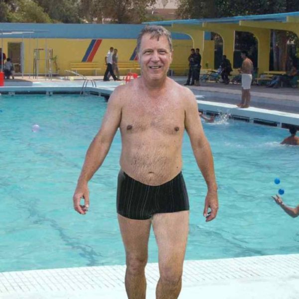 Man Wearing Low-Cut Swimsuit As Though Public Pool A Sun-Kissed Sardinian Cove